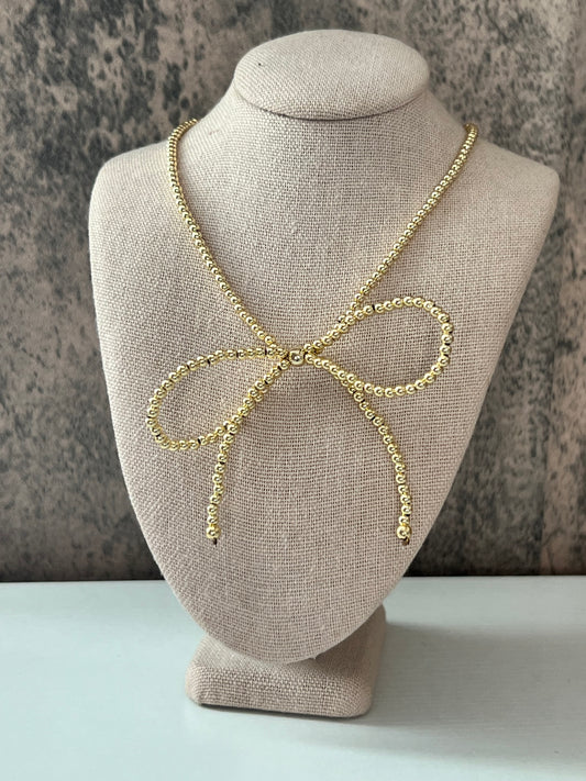 Bow gold laminated necklace